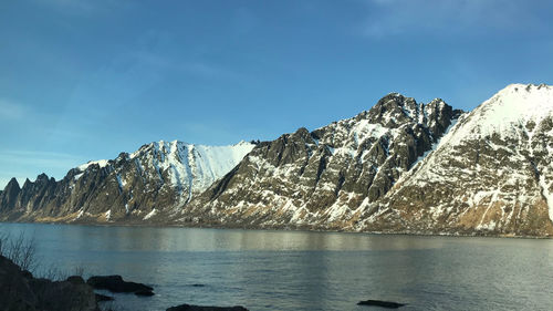 Scenic view of snowcapped mountains against sky