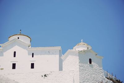 Low angle view of church against clear blue sky