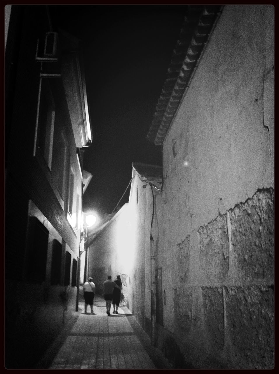 architecture, built structure, building exterior, walking, the way forward, men, full length, lifestyles, rear view, person, building, illuminated, alley, street, walkway, city, city life, diminishing perspective