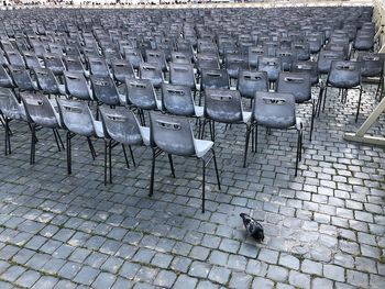 High angle view of empty chairs on street