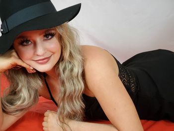 Portrait of beautiful young woman in hat