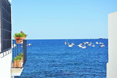 Scenic view of sea against clear blue sky