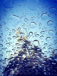 Close-up of raindrops on glass window