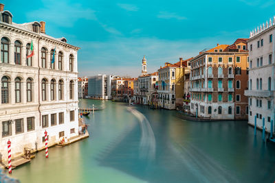 Canal amidst buildings in city