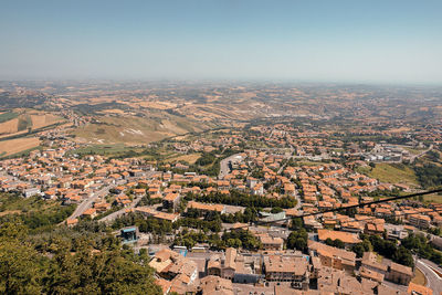 High angle view of houses against clear blue sky