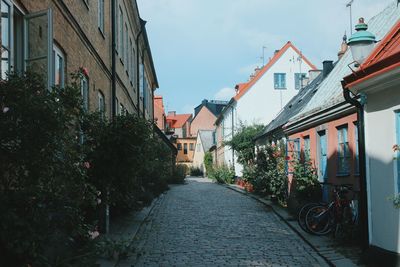 Narrow alley amidst buildings in city