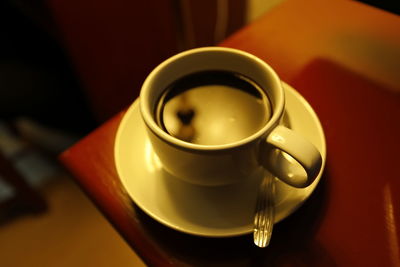 Close-up of coffee cup on table