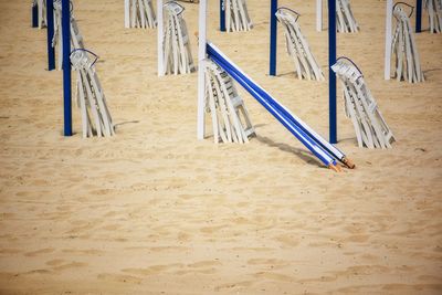 Wooden chairs on sand at playground