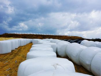 Snow covered land against sky