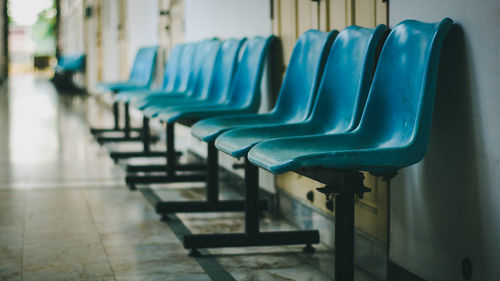 Empty chairs in corridor