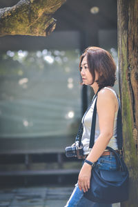 Side view of young woman looking away