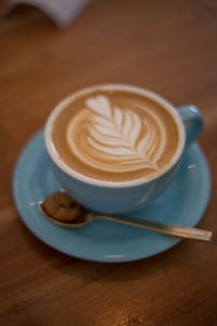 High angle view of cappuccino on table