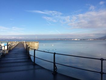 Pier over sea against sky