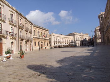 Buildings in city against sky