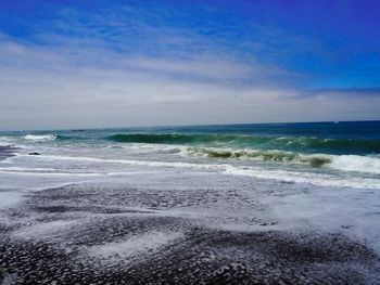 Scenic view of beach against sky