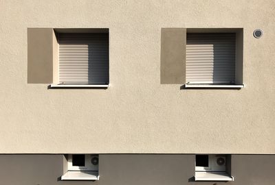 Low angle view of window on wall