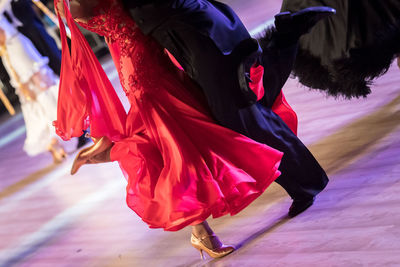 Low section of people dancing on floor