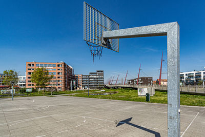 View of basketball court against blue sky