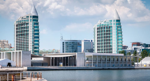 Modern buildings against sky in city