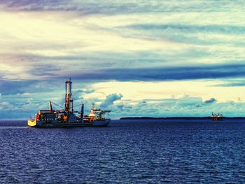 Ship in sea against sky