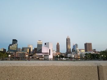 Modern buildings in city against clear sky