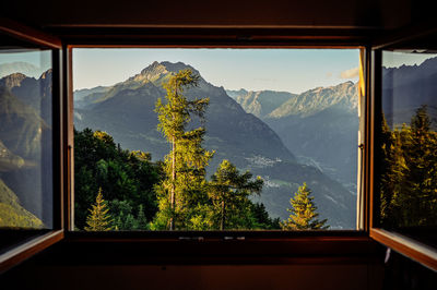 Beautifully window view on swiss alps 