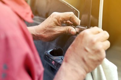 Cropped hand of man working at workshop