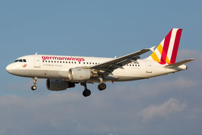 Low angle view of airplane against sky