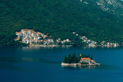 Scenic view of sea and buildings in city