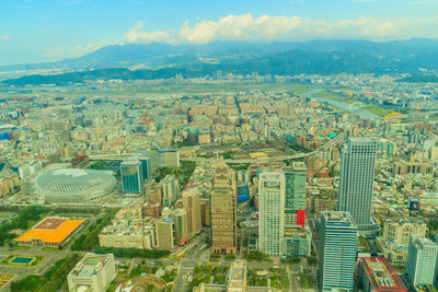 Aerial view of cityscape against sky