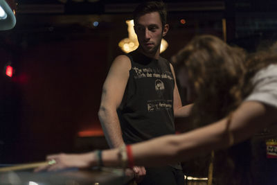Young couple hanging out at a pool hall