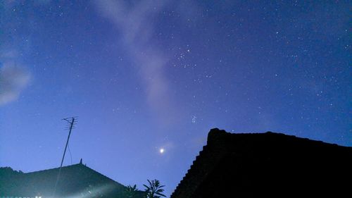 Low angle view of building against sky at night