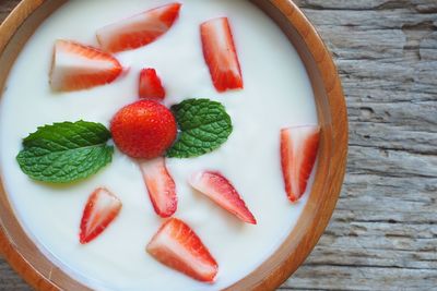 High angle view of strawberries in plate on table