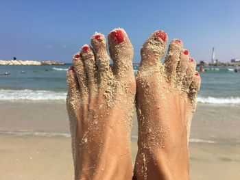 Low section of person on beach