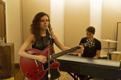 Young musicians practicing at a rehearsal space