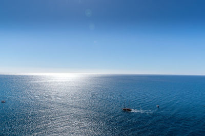 Scenic view of sea against blue sky