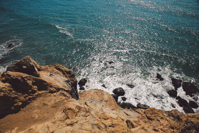 High angle view of rocks in sea