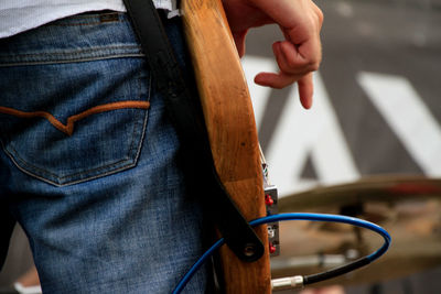 Close-up of man holding cigarette