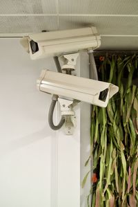 Close up of security camera hanging on wall