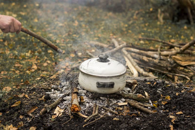 Cooking in a pot outdoor, campfire