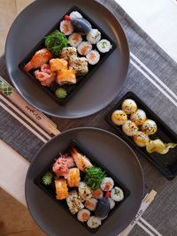 Delicious sushi plate for two on table