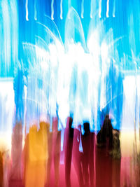 Blurred motion of people at music concert
