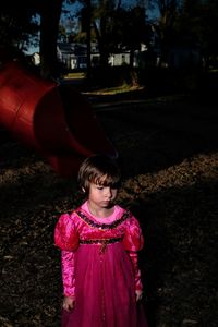 Rear view of girl standing outdoors