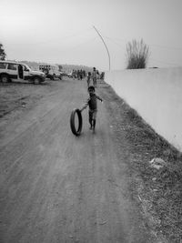 Man riding bicycle on road