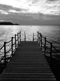 Pier over sea against sky