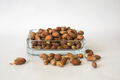 Close-up of peanuts on white background