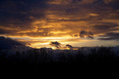 Scenic view of dramatic sky during sunset
