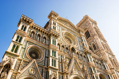 Low angle view of duomo santa maria del fiore against clear sky in city