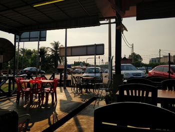 Empty chairs and tables in cafe