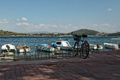 Scenic view of sea by city against sky